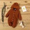 "Trois ensembles bodys bébé variés, haute qualité" (Three baby bodysuits, varied colors, high quality)