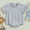 "Romper bébé de qualité, idéal pour l'extérieur" (One-piece baby romper of good quality, ideal for outdoors)