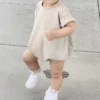 "Romper bébé de qualité, idéal pour l'extérieur" (One-piece baby romper of good quality, ideal for outdoors)